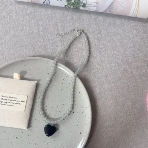 Grey beads, black heart / خرز رمادي وقلب أسود