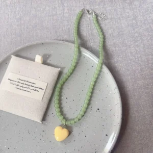 Light green beads, yellow heart / خرز أخضر فاتح وقلب أصفر