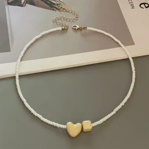 White beads, yellow heart / خرز أبيض وقلب أصفر
