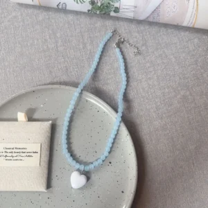 Blue beads, white heart / خرز أزرق وقلب أبيض