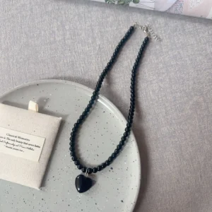 Black beads, black heart / خرز أسود وقلب أسود