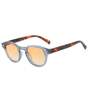 Blue frame with patterned temples, peach lenses / إطار أزرق بأذرع منقوشة وعدسات خوخية